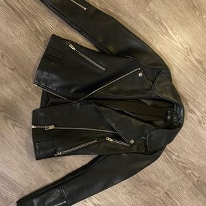 Black leather jacket with hardware detail